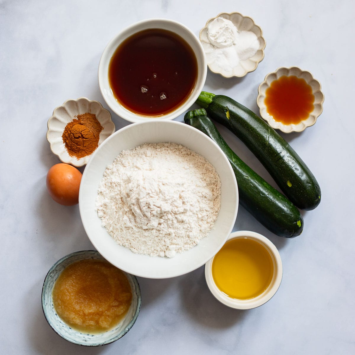 raw ingredients on counter for zucchini muffins