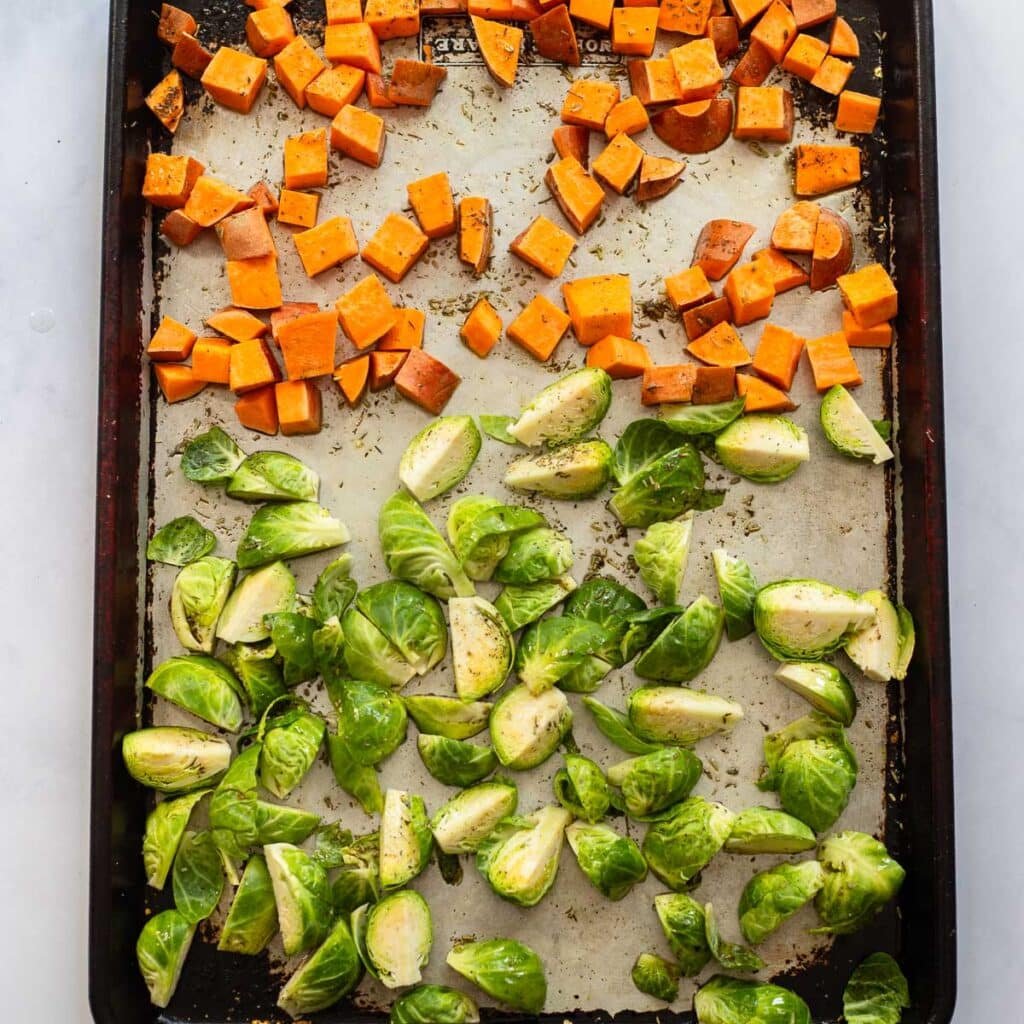 ingredients for harvest bowl on sheet pan for roasting