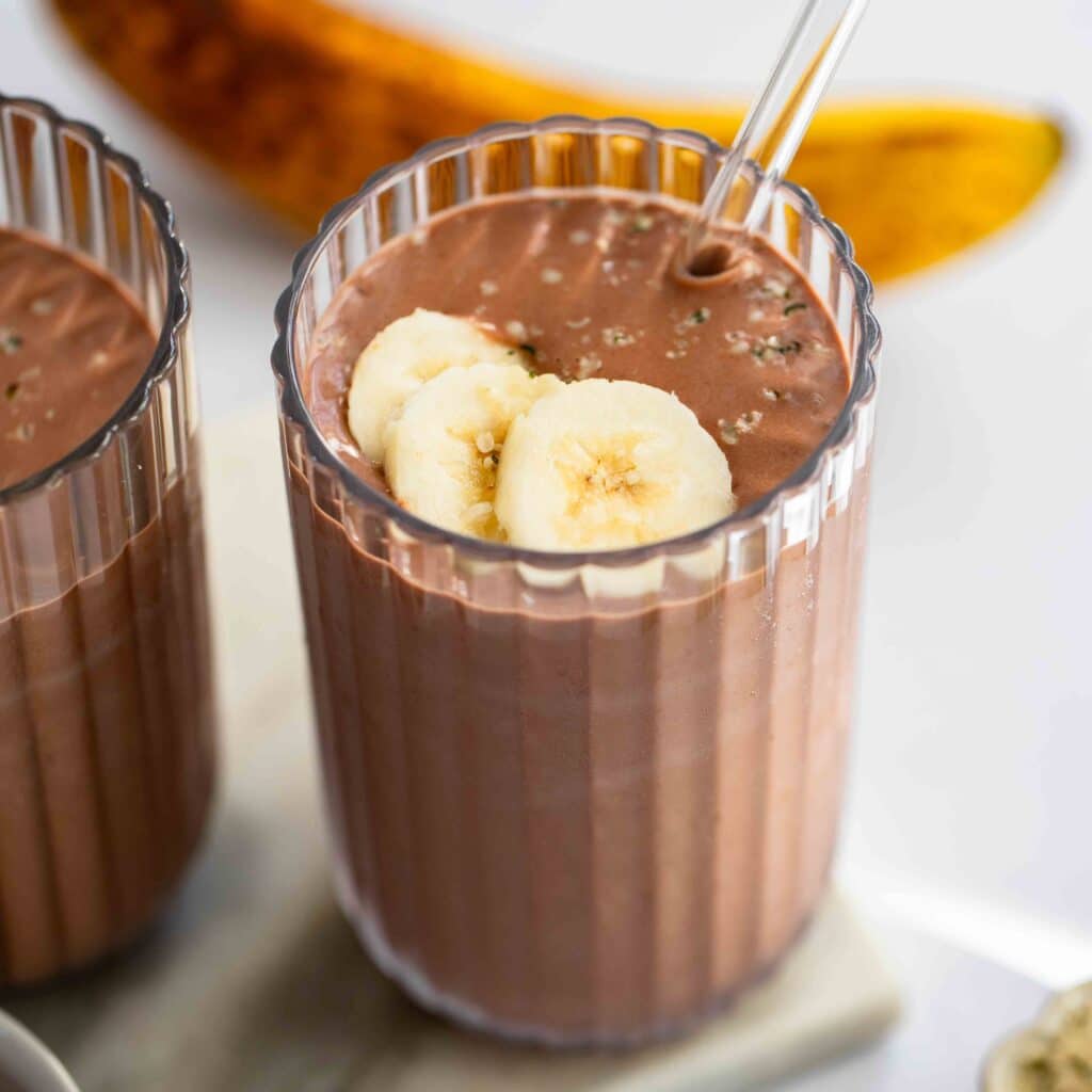 Creamy banana and chocolate smoothie in a glass