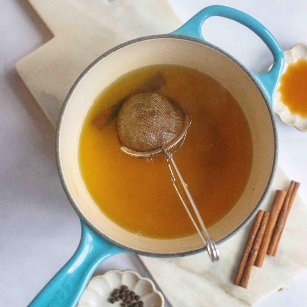 Make ginger and turmeric tea in a bowl