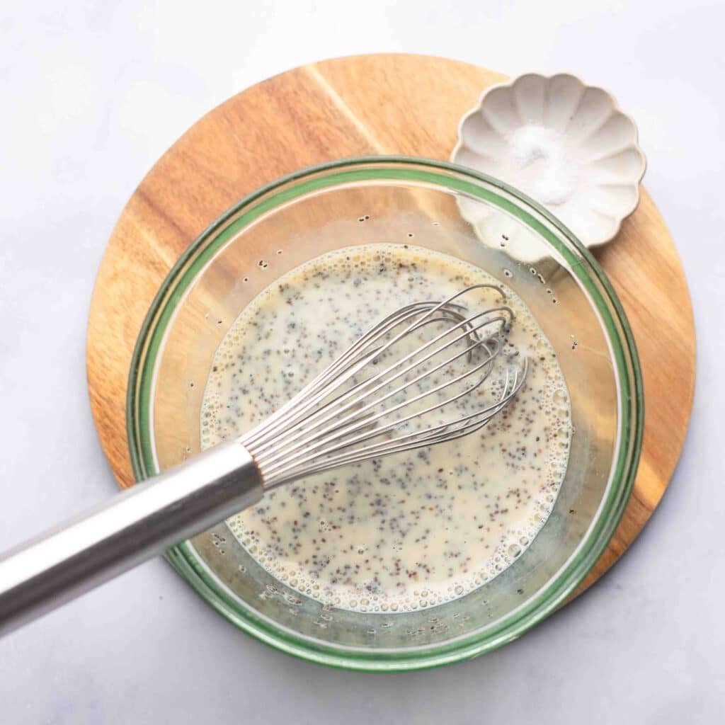 mixing vanilla chia seed pudding in bowl