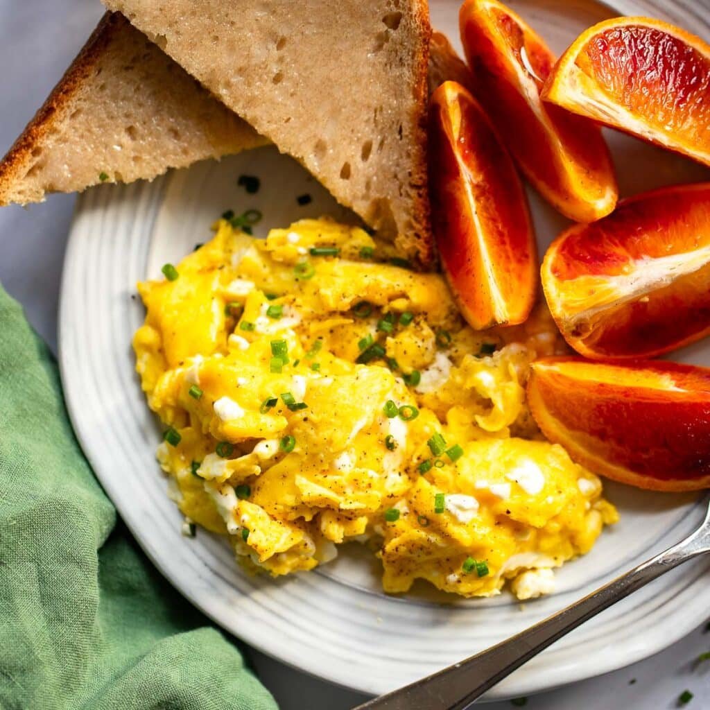 creamy cottage cheese scrambled eggs serve on plate