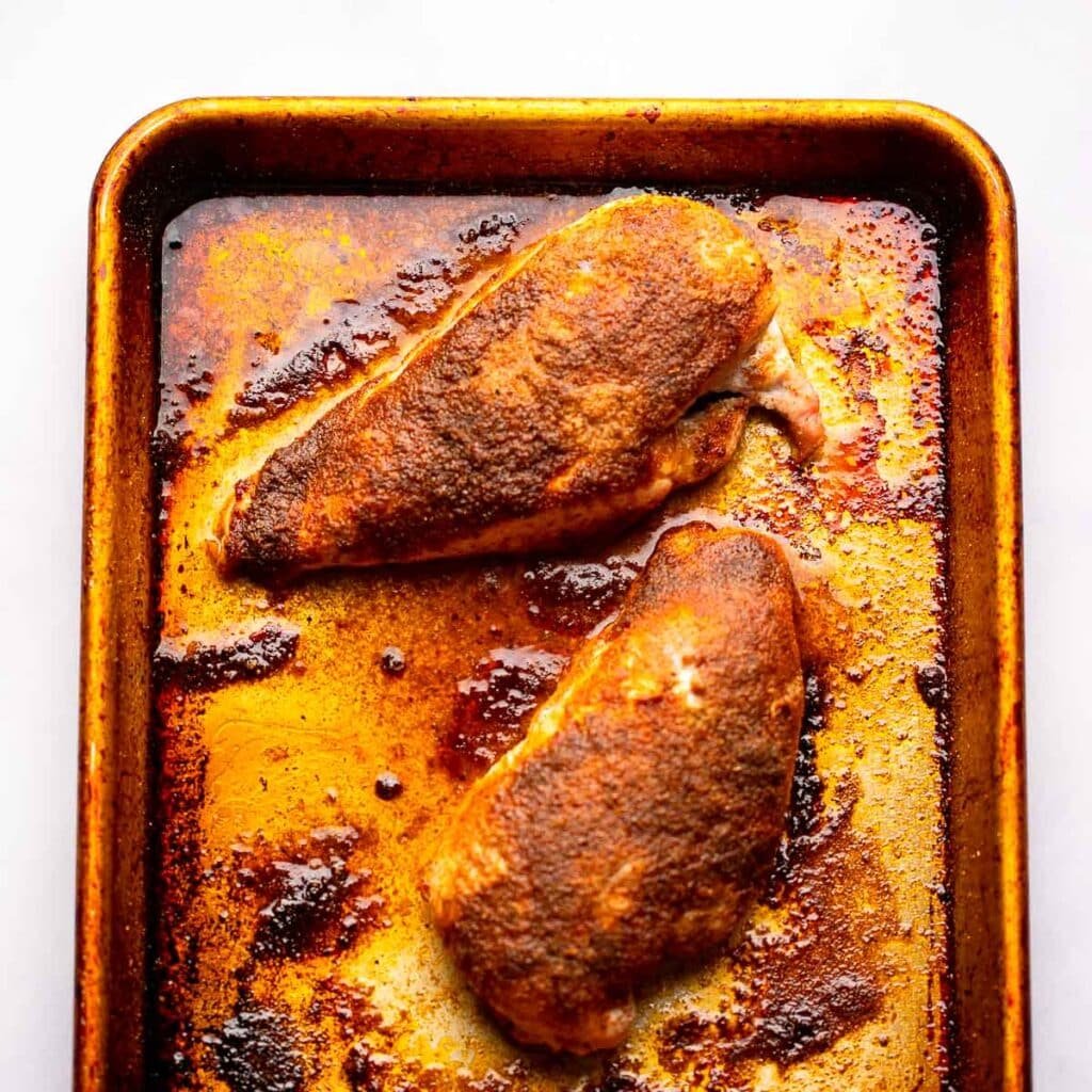 Baked chicken on a skillet for the southwestern chicken salad recipe