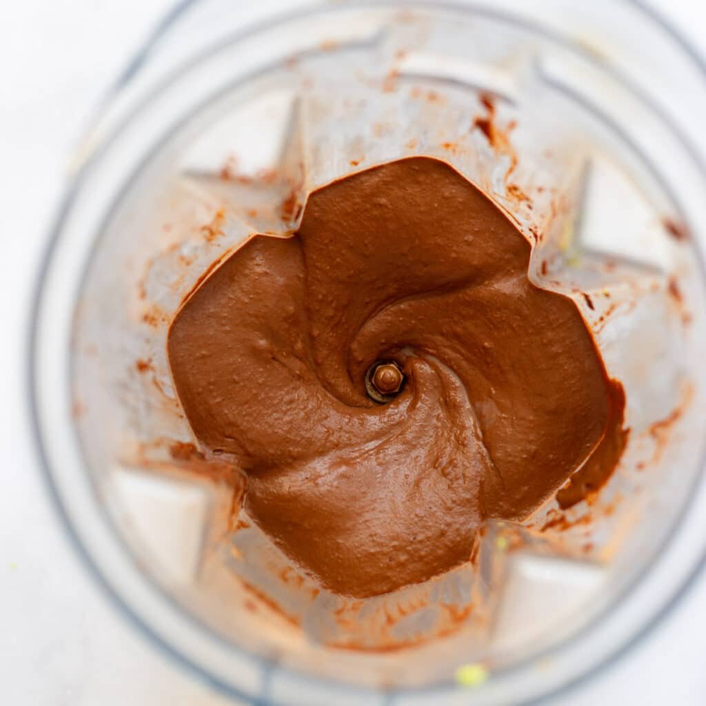 blended chocolate avocado pudding in blender