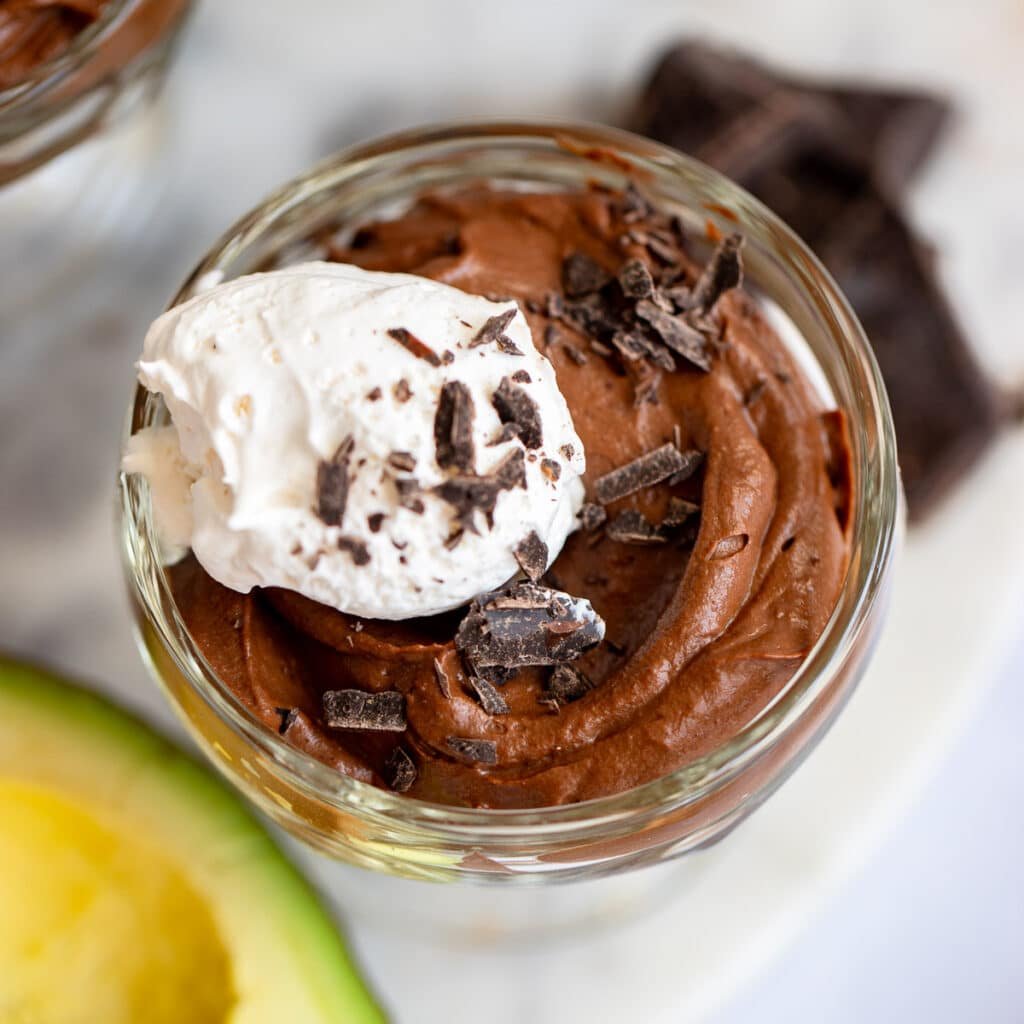 prepared chocolate avocado pudding in glass jar