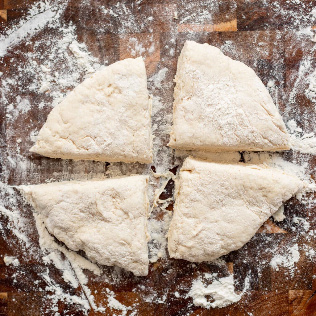 bagel dough divided into four portions 