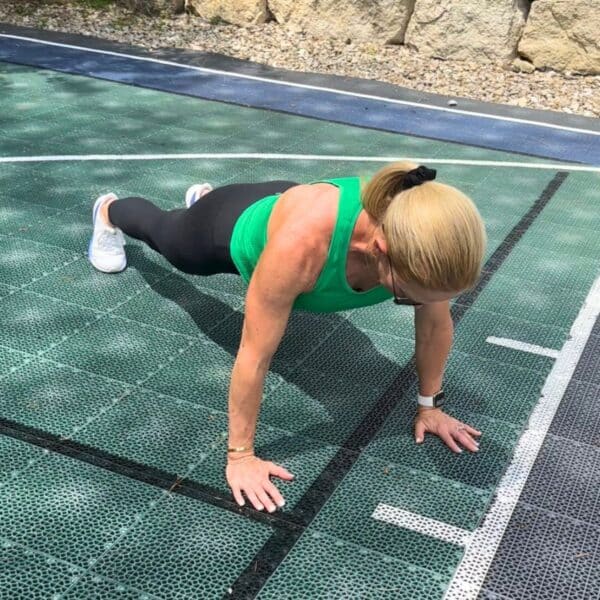 woman showing daily 50 workout exercises outdoors