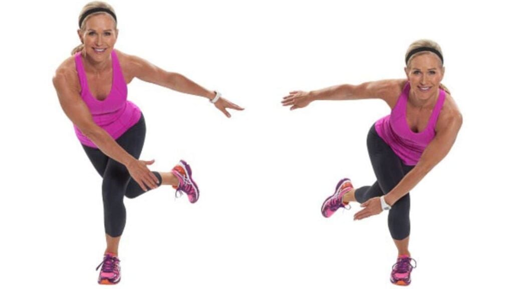 Woman demonstrating exercise in pink athletic wear.