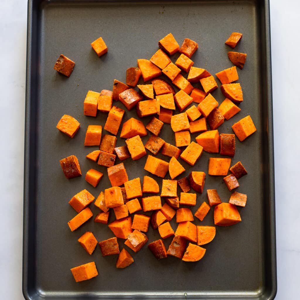 roasted sweet potato cubes on tray