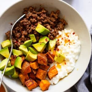 tiktoks viral beef bowl with cottage cheese and honey in bowl