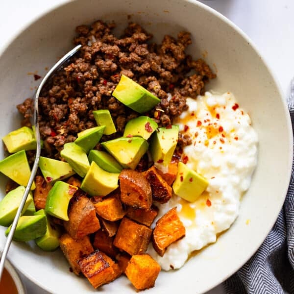 tiktoks viral beef bowl with cottage cheese and honey in bowl