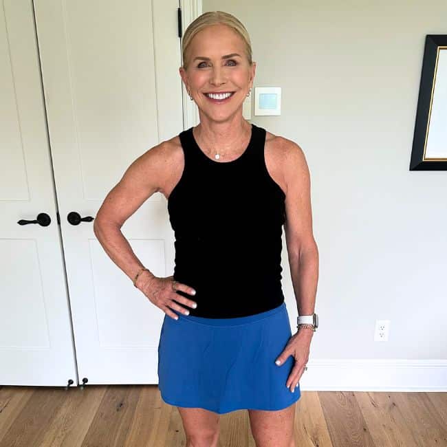 woman wearing colorfulkoala blue athletic skirt from amazon with black tank top