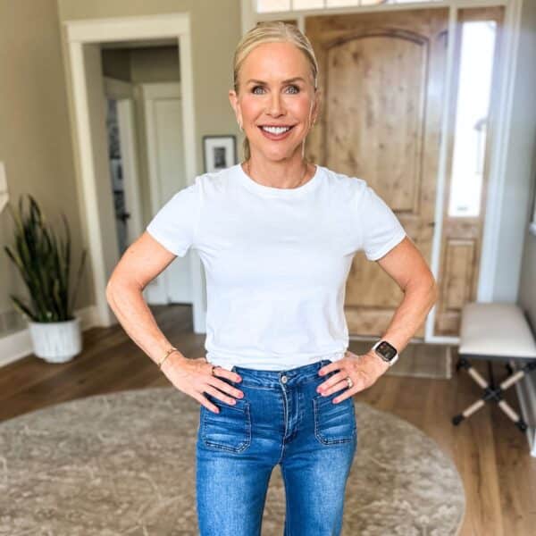 woman smiling in jeans showing how to look 10 pounds lighter instantly