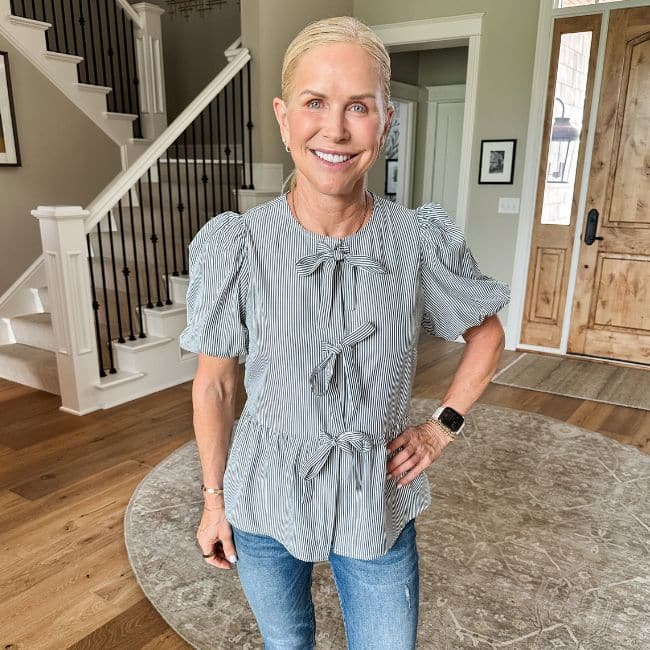 woman wearing flattering top with bow detail