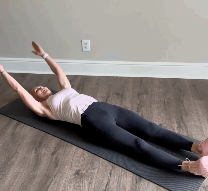 Person performing a stretching exercise on a mat.