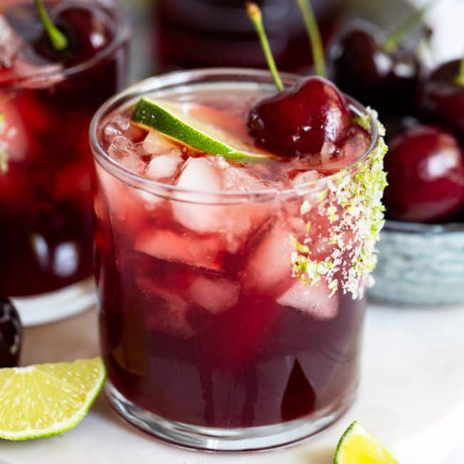 Tart Cherry Hibiscus mocktail recipe made and served in glass with garnish