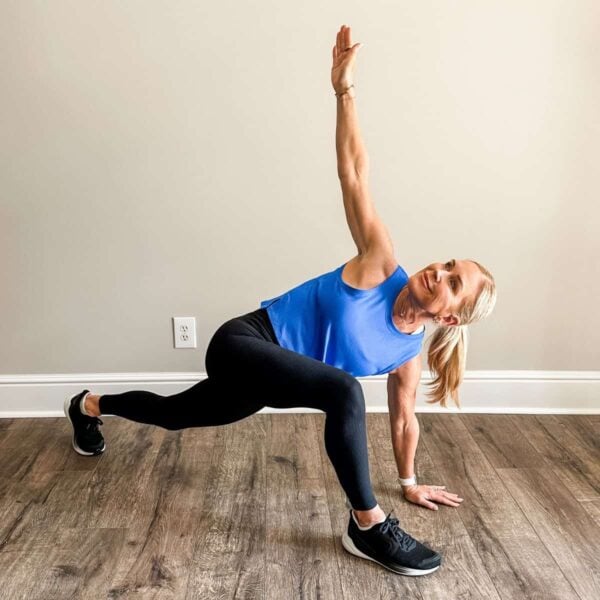 woman showing mobility moves for women over 50 to do before workouts