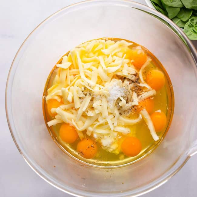 whisking eggs in glass bowl for high protein egg bake