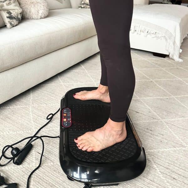 vibration plate fitness close up of woman in living room