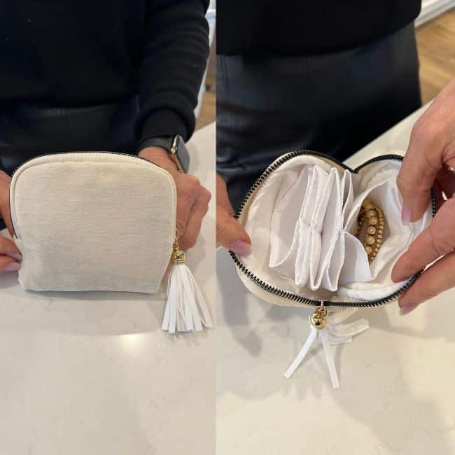 Compact travel jewelry organizer with necklaces and earrings neatly arranged