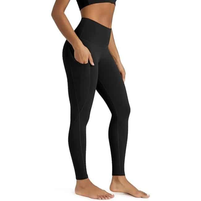 Woman wearing ODODOS crossover high-waisted Amazon leggings with a flattering waistband