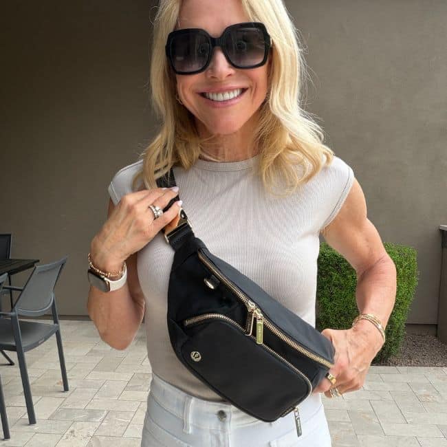 Collection of neutral tops including striped shirt, tank, and tee designed for easy outfit pairing in a capsule wardrobe