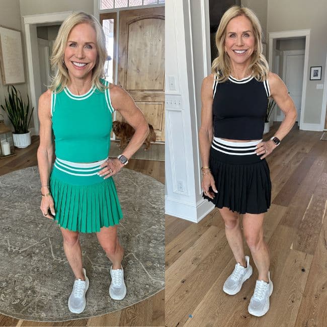 Woman over 50 wearing sporty tennis and golf matching skirt set with athletic stripe details outdoors